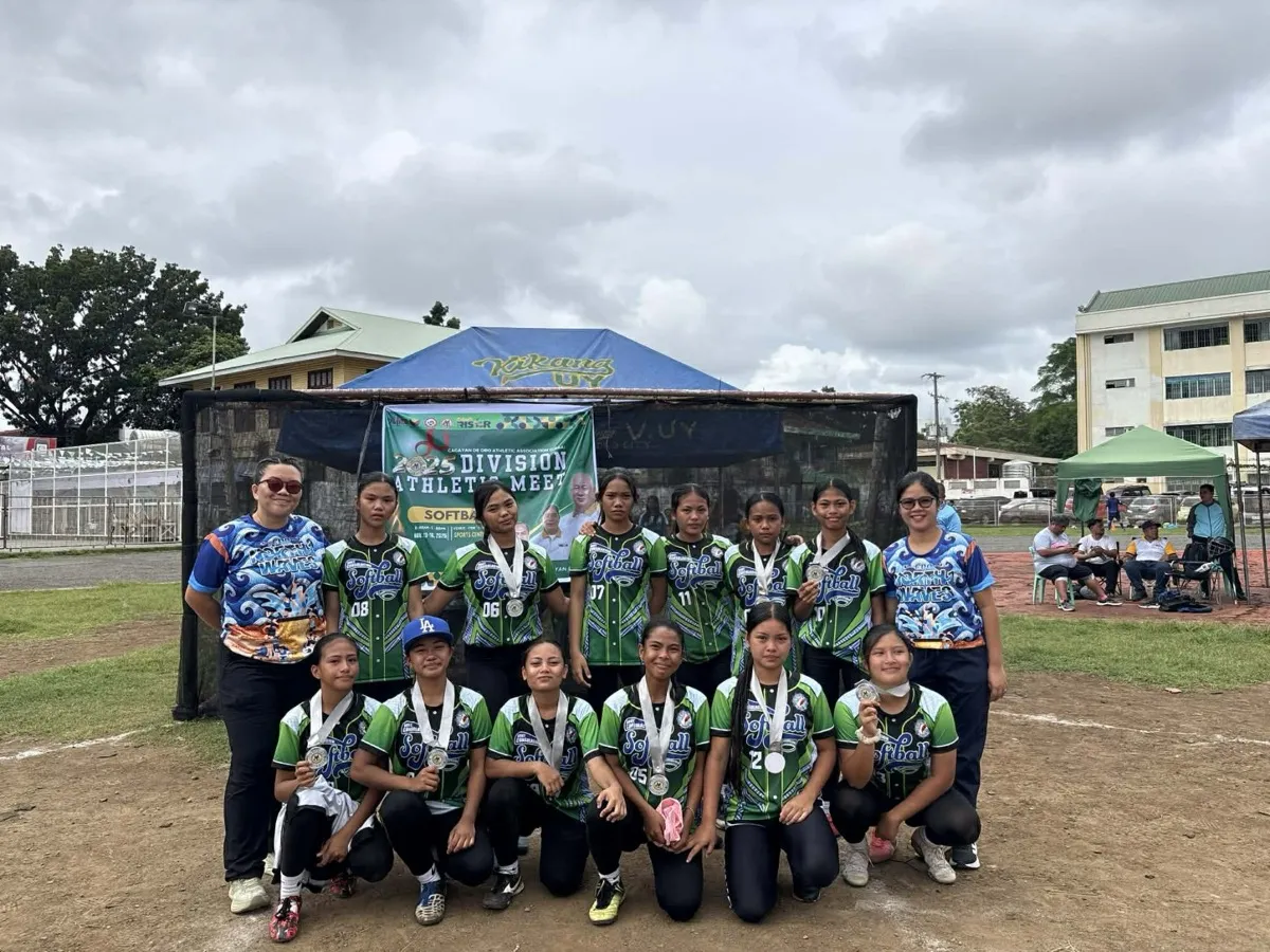 Softball team posing with medals at Division Athletic Meet