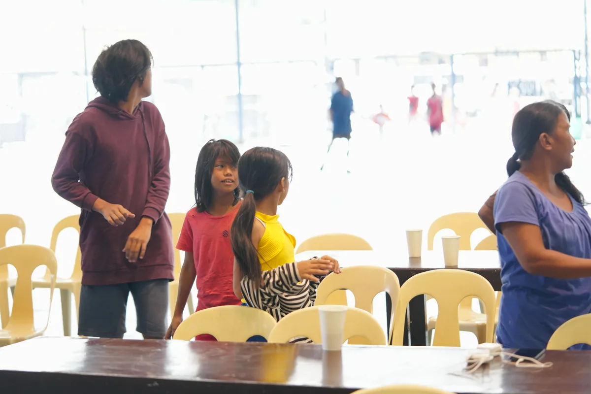 Relief goods distribution during community outreach in Bukidnon