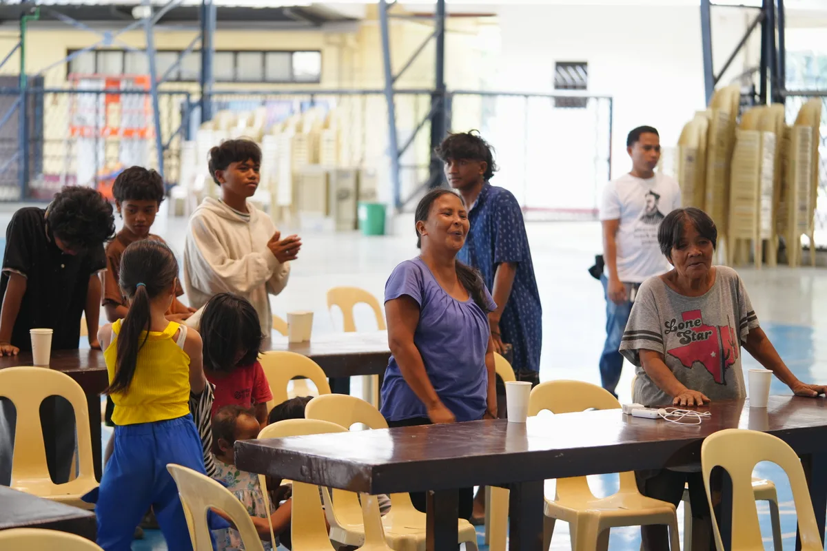 Families gathered together at the feeding program
